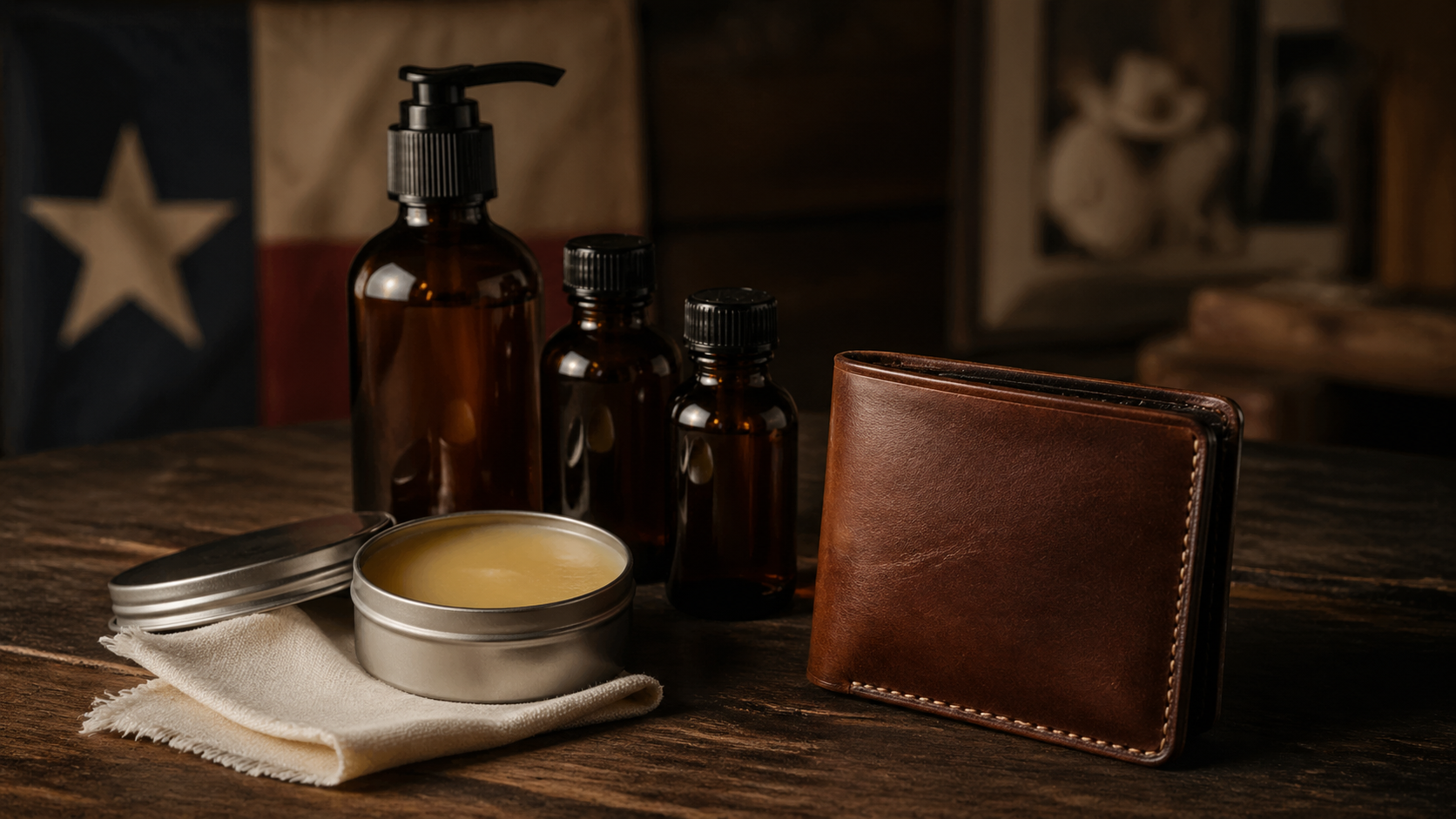 Leather conditioner bottles beside full-grain leather wallet on wooden surface