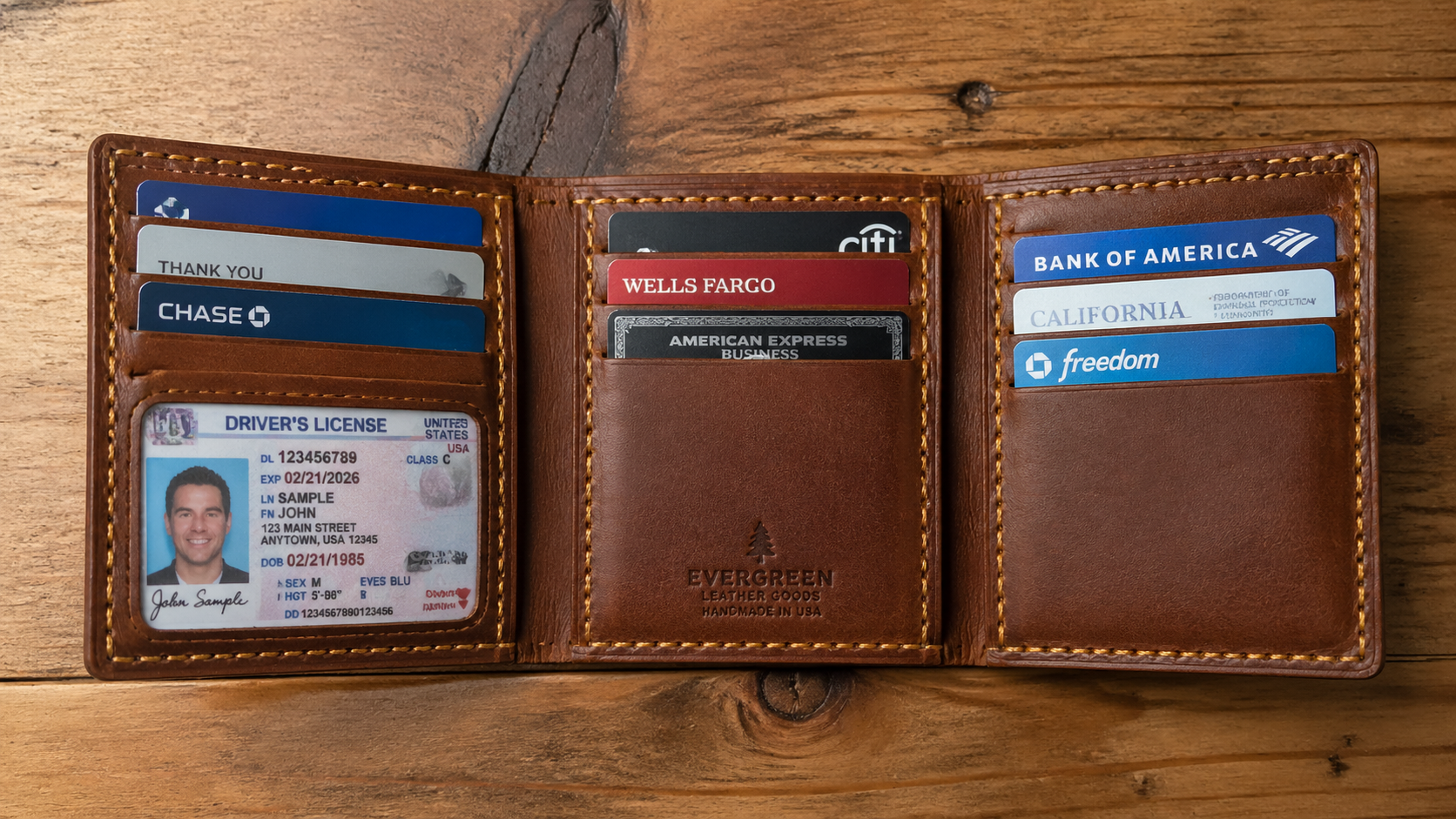 Leather trifold wallet open showing full card capacity and bill compartment